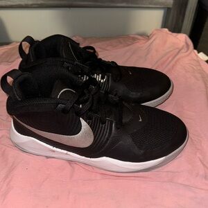 Black and silver Nike tennis shoes  for big kids size 4.5y